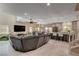 Expansive living room featuring an open layout, modern decor, and seamless transition to the dining and kitchen areas at 7613 Pulpit Rock Ct, Las Vegas, NV 89166