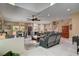 Open-concept living room featuring a modern design, dining area, and seamless flow into the kitchen space at 7613 Pulpit Rock Ct, Las Vegas, NV 89166