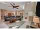 Comfortable living room features a large sectional sofa, ceiling fan, and neutral color palette at 7613 Pulpit Rock Ct, Las Vegas, NV 89166