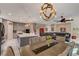 Open-concept living space with kitchen, living room, and dining area featuring modern furnishings at 7613 Pulpit Rock Ct, Las Vegas, NV 89166