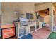Backyard with a complete outdoor kitchen, patio with a hot tub, and cozy seating at 7613 Pulpit Rock Ct, Las Vegas, NV 89166