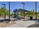 Shaded picnic area with tables and seating, perfect for outdoor gatherings and Gathering fun in the park at 7613 Pulpit Rock Ct, Las Vegas, NV 89166