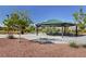 Shaded picnic area with tables and seating offers a relaxing space for outdoor gatherings in the community park at 7613 Pulpit Rock Ct, Las Vegas, NV 89166