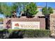Neighborhood entrance sign for Westcott with stone accents and manicured shrubs at 7613 Pulpit Rock Ct, Las Vegas, NV 89166