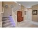 Elegant staircase with carpeted steps and a decorative hutch at 7613 Pulpit Rock Ct, Las Vegas, NV 89166