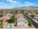 Captivating aerial perspective of the house with its pool and the serene landscape at 7857 Midnight Ride St, Las Vegas, NV 89131