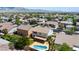 Beautiful aerial shot of the home featuring a private pool, covered patio, and lush landscaping at 7857 Midnight Ride St, Las Vegas, NV 89131