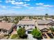 Gorgeous aerial image of the home featuring landscaping, pool, and neighborhood at 7857 Midnight Ride St, Las Vegas, NV 89131