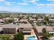 Stunning aerial view of the property showcasing the pool, patio, and surrounding neighborhood at 7857 Midnight Ride St, Las Vegas, NV 89131