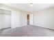 Bedroom with neutral walls, carpet, and closet featuring white sliding doors at 7857 Midnight Ride St, Las Vegas, NV 89131