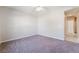 Neutral bedroom showcasing plush carpet, white trim, and ample natural light perfect for relaxation at 7857 Midnight Ride St, Las Vegas, NV 89131