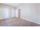 Spacious carpeted bedroom features ample closet space for convenient storage at 7857 Midnight Ride St, Las Vegas, NV 89131