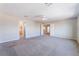 Primary bedroom with plush carpeting and access to both an ensuite bathroom and walk-in closet at 7857 Midnight Ride St, Las Vegas, NV 89131
