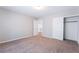 Bedroom featuring neutral walls and carpet and white closet sliding doors at 7857 Midnight Ride St, Las Vegas, NV 89131