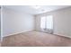 Neutral bedroom featuring carpet and white curtains covering the window at 7857 Midnight Ride St, Las Vegas, NV 89131