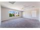 Light-filled bonus room with large windows offering views of lush trees and ample sunlight at 7857 Midnight Ride St, Las Vegas, NV 89131