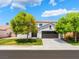 Charming two-story home featuring a well-maintained lawn and a two-car garage at 7857 Midnight Ride St, Las Vegas, NV 89131