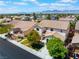 Beautiful two-story home with a tile roof, desert landscaping, and mountain views at 7857 Midnight Ride St, Las Vegas, NV 89131