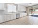 Kitchen featuring stainless steel appliances, white cabinetry and a convenient dishwasher at 7857 Midnight Ride St, Las Vegas, NV 89131