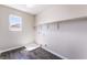 Laundry room with modern dark wood-look floors and natural lighting at 7857 Midnight Ride St, Las Vegas, NV 89131
