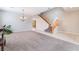 Open living area featuring a staircase and large windows at 7857 Midnight Ride St, Las Vegas, NV 89131