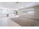 Spacious living area featuring a modern kitchen and ample natural light at 7857 Midnight Ride St, Las Vegas, NV 89131
