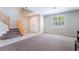 Open living area featuring a staircase and views to other rooms at 7857 Midnight Ride St, Las Vegas, NV 89131