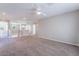 Expansive upstairs loft area with plush carpeting, neutral colors, and multiple doorways for easy access at 7857 Midnight Ride St, Las Vegas, NV 89131