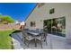 Outdoor patio with a table set and view of the rear of the house at 8041 Villa Rosarito St, Las Vegas, NV 89131
