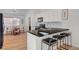 Bright kitchen featuring a breakfast bar with black countertops and white cabinets at 8041 Villa Rosarito St, Las Vegas, NV 89131