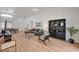 Open living room with wood floors, a gray sectional sofa, and modern decor at 8041 Villa Rosarito St, Las Vegas, NV 89131