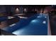 Relaxing backyard pool and spa with outdoor seating area, perfect for nighttime entertaining at 8041 Villa Rosarito St, Las Vegas, NV 89131