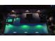 Overhead shot of an outdoor pool and hot tub with palms and night lighting at 8041 Villa Rosarito St, Las Vegas, NV 89131