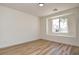Bedroom with light wood floors, window, and bright natural light at 8080 Black Orchid Ave, Las Vegas, NV 89131