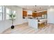 Well-lit kitchen boasts a large central island with bar seating and stainless steel appliances at 8080 Black Orchid Ave, Las Vegas, NV 89131