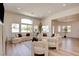Expansive living room with an open layout, large windows, and contemporary decor, perfect for gatherings at 8080 Black Orchid Ave, Las Vegas, NV 89131