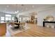 Open-concept living space with a dining area, modern kitchen, and elegant decor, perfect for entertaining at 8080 Black Orchid Ave, Las Vegas, NV 89131