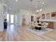 Bright and airy open space featuring a dining area with modern lighting and neutral color palette at 8080 Black Orchid Ave, Las Vegas, NV 89131