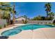 Inviting pool and spa surrounded by lush landscaping and a spacious patio at 8080 Black Orchid Ave, Las Vegas, NV 89131