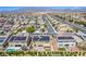 Beautiful home with solar panels, covered patio, and landscaping, nestled in a well-planned community with mountain views at 813 Bluebird Hill Ave, North Las Vegas, NV 89084