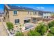 A large backyard boasts a hot tub, covered patio, BBQ island, with a small turf area at 813 Bluebird Hill Ave, North Las Vegas, NV 89084