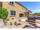 This backyard showcases a spa, seating, desert landscaping, and a fire pit at 813 Bluebird Hill Ave, North Las Vegas, NV 89084