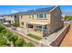 Enjoy the spacious backyard with a covered patio, built-in BBQ, lush turf, and a relaxing hot tub at 813 Bluebird Hill Ave, North Las Vegas, NV 89084