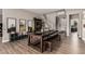 Dining area with a dark wood table and bench seating with views of the staircase and office at 813 Bluebird Hill Ave, North Las Vegas, NV 89084