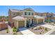 Charming two-story home features a well-maintained front yard, a two-car garage, and a welcoming entrance at 813 Bluebird Hill Ave, North Las Vegas, NV 89084