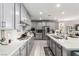 Modern kitchen with gray cabinets, stainless steel appliances and a white countertop at 813 Bluebird Hill Ave, North Las Vegas, NV 89084