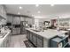 Modern kitchen boasts stainless steel appliances, a large island, and ample cabinet space, perfect for cooking and entertaining at 813 Bluebird Hill Ave, North Las Vegas, NV 89084