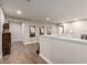Upper landing with wood floors, neutral paint, and decorative artwork at 813 Bluebird Hill Ave, North Las Vegas, NV 89084