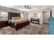 Comfortable main bedroom with a large rug, ceiling fan and backyard views at 813 Bluebird Hill Ave, North Las Vegas, NV 89084