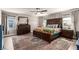 Spacious main bedroom with wood flooring, ceiling fan, and natural light at 813 Bluebird Hill Ave, North Las Vegas, NV 89084